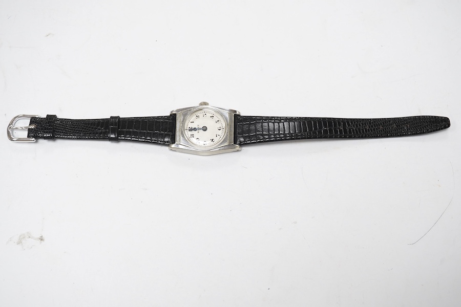 A gentleman's mid 20th century stainless steel Rolex manual wind wrist watch, with Arabic dial and Rolex and Enivar movement, case diameter 24mm, on a later associated leather strap. Condition - poor to fair